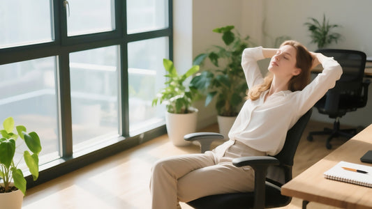 Woman stretching at her desk to promote work-life balance and stress relief, highlighting the importance of daily cortisol support and simple stress management habits.